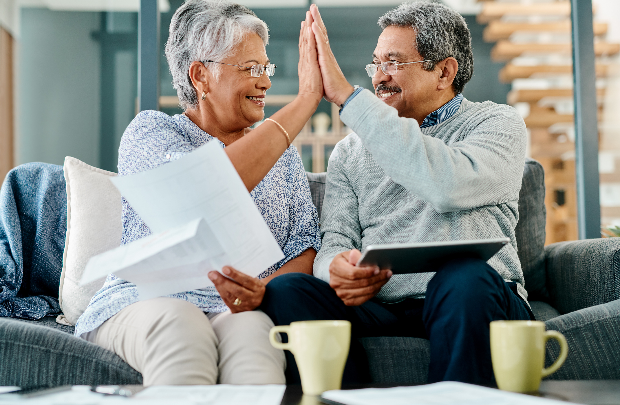 Illinois Gold IRA Investing Company getty couple high five happy